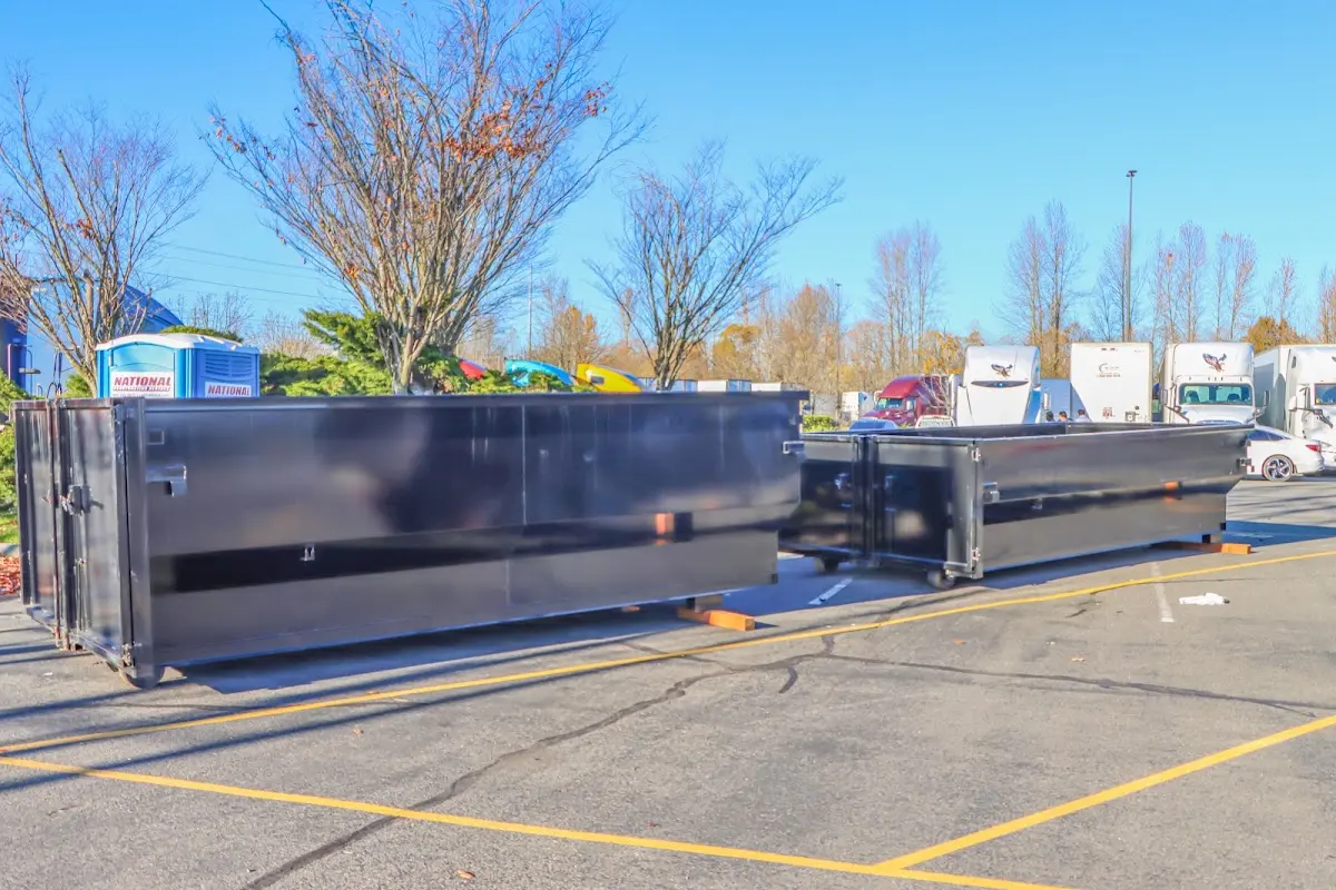 Professional dumpster rental service with roll-off container on residential driveway in Scottsdale